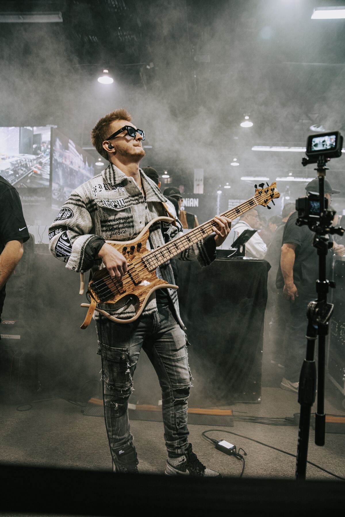 Gabriel Severn performing on stage with his bass